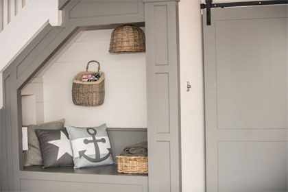 Under stairs space with seating area and cushions